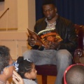 Benjamin Watson reading to children