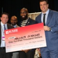 Malcolm Jenkins holding $100,000 check from the NFLPA